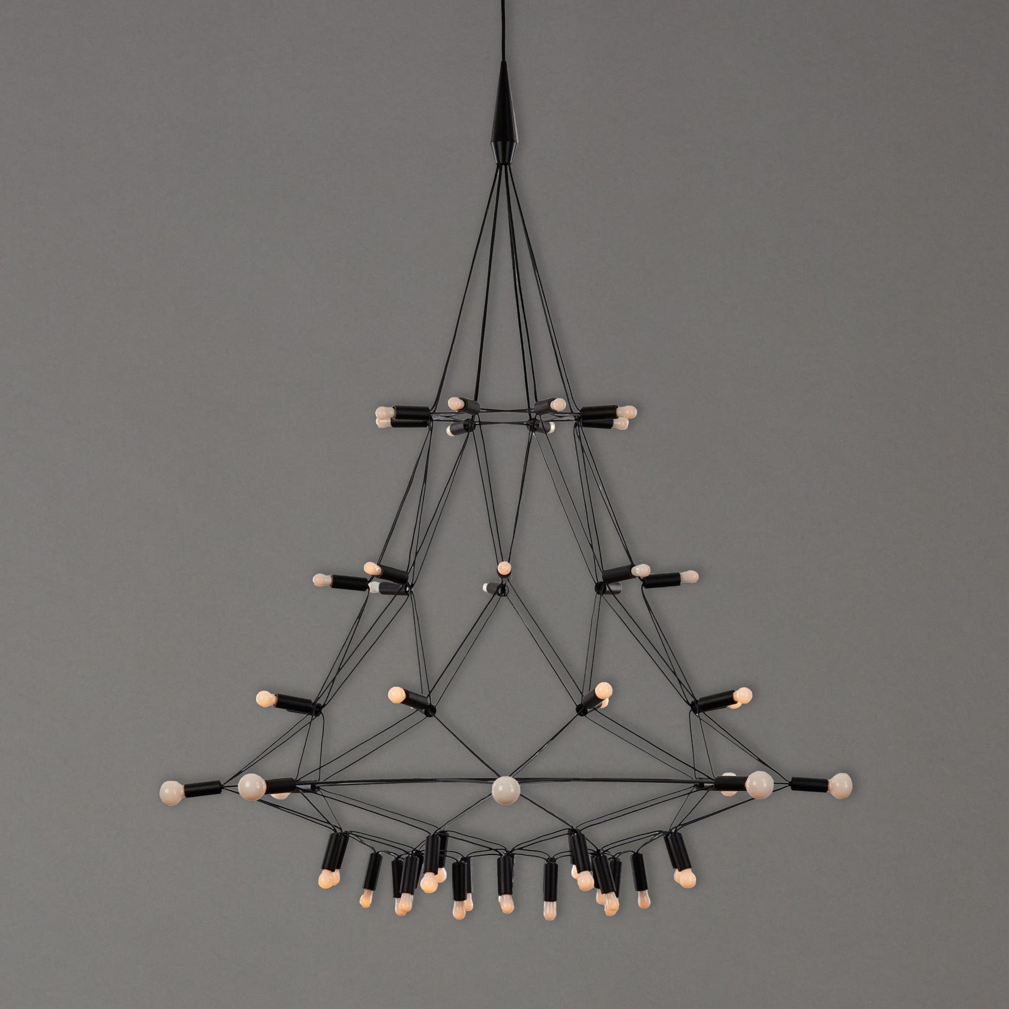 Geometric chandelier with black and white design by Patrick Townsend on a gray background