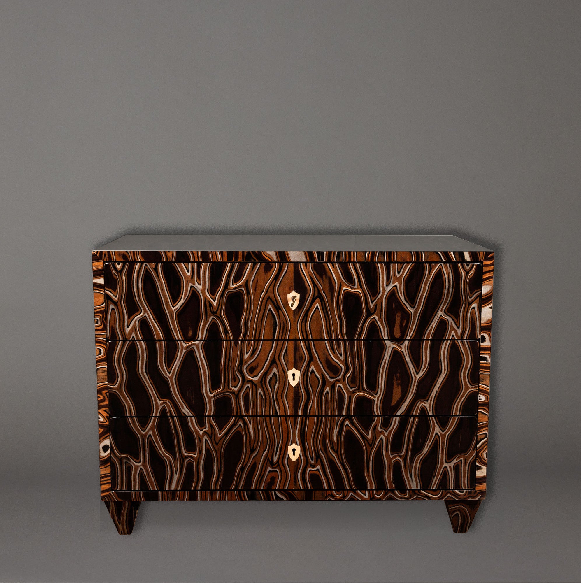 Wooden dresser with a unique brown and black pattern on a gray background